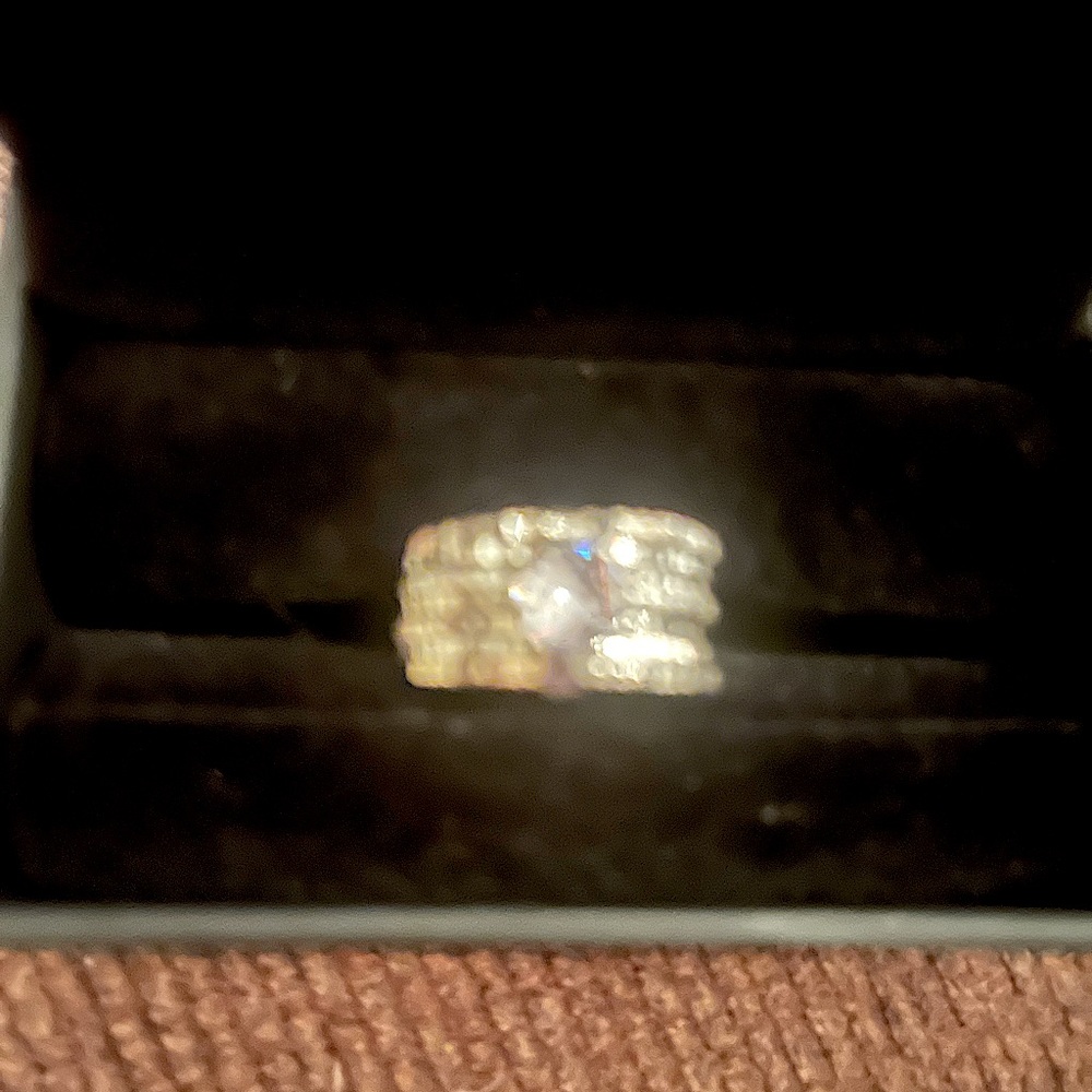Brand new, never worn, sterling silver multi size 7 with cubic zirconia